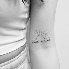 a woman's arm with a tattoo that reads smile and sun on the side