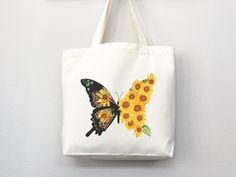 Bring a touch of nature's beauty to your everyday look with our Butterfly Sunflower Tote Bag. Made from high-quality, eco-friendly materials, this bag features a stunning design of butterfly and sunflower that is sure to turn heads. Spacious and practical, it's perfect for carrying all your essentials, whether you're running errands or heading to work. Comfortable to carry with its sturdy handles, this tote is a must-have for any nature lover. Order now and bring a little bit of nature's beauty Botanical Style Bags For Spring, Large Capacity Natural Canvas Bag As Gift, Large Capacity Natural Canvas Bag Gift, Natural Large Capacity Canvas Bag For Gifts, Casual Rectangular Canvas Bag Gift, Casual Rectangular Canvas Bag For Gift, Spring Canvas Bag Large Capacity Gift, Casual Mother's Day Canvas Gift Bag, White Canvas Bag For Spring Gift