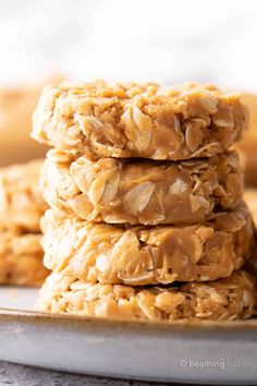 three cookies stacked on top of each other with peanut butter and oats in the middle