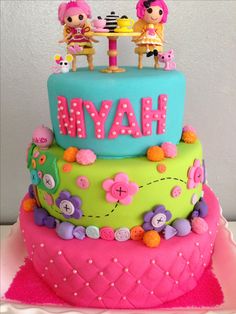 a birthday cake with the name haym on it, decorated in pink and blue icing