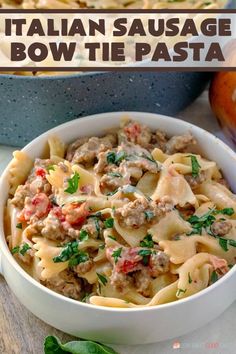 a white bowl filled with pasta and meat sauce