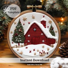 a red barn with trees and snow on it in front of a christmas tree, surrounded by pine cones