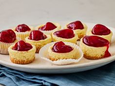 small cupcakes with jam on them are sitting on a plate