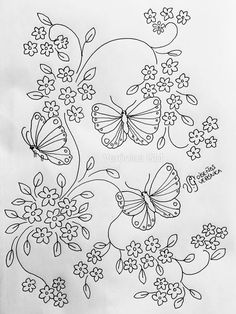 some flowers and butterflies are drawn on paper