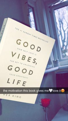 a book with the title good vibes, good life hanging from it's side