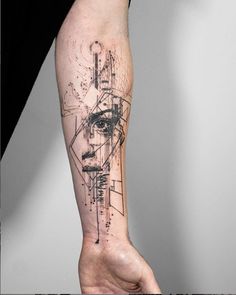 a person's arm with a tattoo on it that has an image of a woman's face