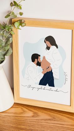 a framed photo of two people kissing in front of a potted plant on a shelf