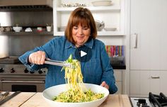 a woman is stirring some food in a bowl