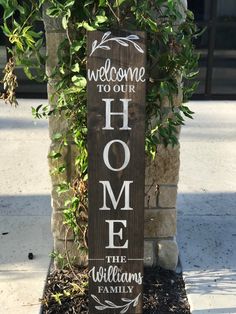 a wooden sign that says welcome to our home