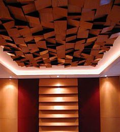 an empty room with wooden shelves and lights