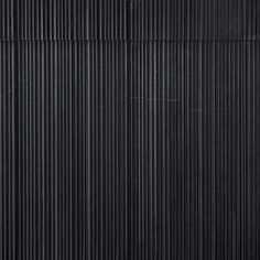 an abstract black and white background with vertical lines in the center, as well as horizontal stripes on the wall