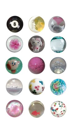 twelve glass knobs with different designs on them