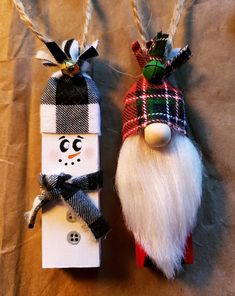 two christmas decorations made out of wood and fabric