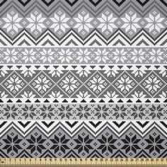 an abstract knitted pattern in grey and white