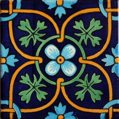 a blue and yellow tile with flowers on it