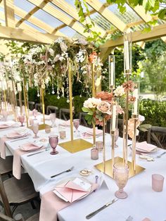 the tables are set with pink napkins and place settings