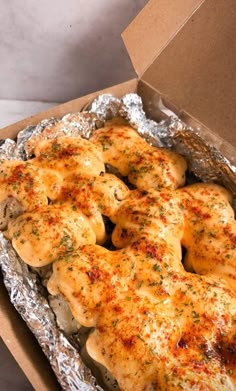 the chicken is cooked and ready to be eaten in the box on the counter top