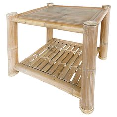 a bamboo side table with one shelf on top