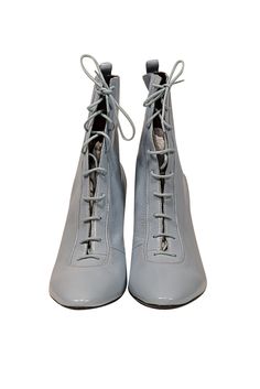 Slip into these playful Marc Jacobs boots and step up your spring fashion game. The baby blue leather and Victorian lace-up style will add a unique touch to any outfit. Pair with a floral puff sleeve dress and a chic bow for the ultimate transition look! Size 10 (IT 40) Leather upper, lining, and sole Lace up front tie Round toe Comes with a dust bag Heel height 3.5" Casual Lace-up Heeled Boots For Spring, Spring High Ankle Boots With Laces, High Ankle Boots With Laces For Spring, High Ankle Lace Boots For Spring, Spring Ankle Boots With Laces, Spring High-top Lace-up Boots, Trendy Fitted Lace-up Boots With Round Toe, High Ankle Lace-up Boots For Spring, Spring High-top Heeled Boots With Reinforced Heel