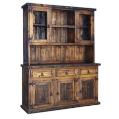 an old wooden cabinet with drawers and doors