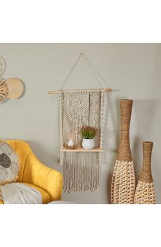 a yellow chair and some vases in a room