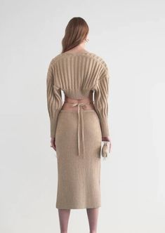 Designed by Cult Gaia. Elevate your look with the Rosie top and sweater set. Designed in a neutral-hued ribbed knit, the two-piece knit set comes with a ribbed cropped camisole and separate knit shawl to match. With a slightly oversized fit at the back bodice and shoulders, the Rosie gives you both structure and comfort. Skirt not included. Fit: Model is 5'9" and is wearing a size Small. Slim fitting bralette with slightly oversized shawl. Stretchy rib knit. Materials + Care: 100% Cotton. hand w Knitting Fashion, Knitwear Inspiration, Cropped Camisole, Knit Shawl, Cult Gaia, Black Women Fashion, Knitted Shawls, Sweater Set, Knit Fashion