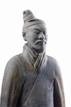 a statue of a man with a hat on his head