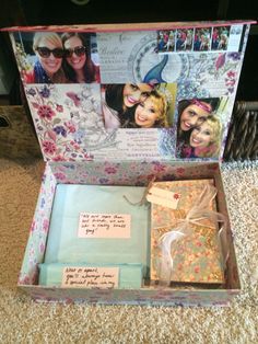 an open gift box with pictures on it