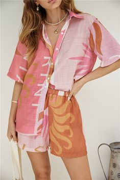 Turn up the heat in our Heating Up Set in Pink, a sizzling and stylish ensemble perfect for poolside lounging or rooftop parties on balmy summer nights.  Shirt and shorts set, relaxed fit Shirt, unlined Pointed collar Short sleeves Button front  Shorts, lined Elasticated waistband  100% Polyester Non-stretch material  Print placement may vary Please refer to the care label on garment for specific instructions on how to care for it Model wears XS Spring Break Dress, Gold Maxi Dress, Lover Dress, Shirt And Shorts Set, White Slip Dress, White Long Sleeve Dress, Skirt And Top Set, Travel Outfits, Shirt And Shorts