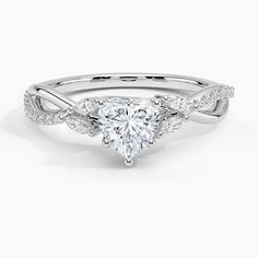 a heart shaped diamond ring with twisted band