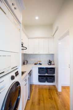 a washer and dryer in a small room