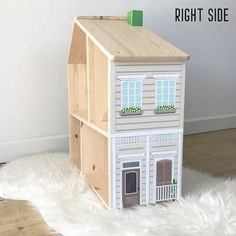 a doll house made out of plywood and wood with the words right side painted on it