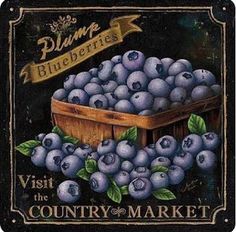 blueberries are in a wooden crate with green leaves on the bottom and below it