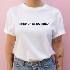 "Tired of Being Tired T-shirt Cool Casual Tumblr Grunge Tee AVAILABLE SIZES: S,M,L,XL,2XL,3XL COLOR: WHITE, BLACK, HEATHER GREY CONDITION: BRAND NEW T-SHIRT SPECS : 100% high quality pre-shrunk cotton (165 g/m2) jersey). Taped neck and shoulders, twin needle stitching, seamless collar. PRINT: Highest quality print - not cheap \"iron-on\" transfers! MEASUREMENTS : width - armpit to armpit ; length - the body length is measured in a straight line from the highest point of the shoulder at the join Outfits 90s Hip Hop, Vaporwave Shirt, Tumblr Grunge, Tumblr T Shirt, Grunge Tee, Urban Apparel, Outfit 90s, Hip Hop Outfits, T Shirt Diy