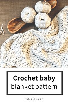 crochet baby blanket pattern with yarn and scissors on the table next to it