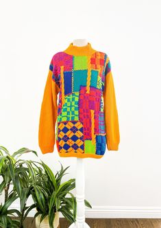 "This vintage 1980s sweater from IB Diffusion Sport brings us joy over here at Origin Vintage. With an array of bold and beautiful colors and funky patterns, it's the perfect way to brighten up a gray day. The sweater has shoulder pads that could be easily removed if desired and is in great vintage condition; structurally sound with minimal cosmetic flaws. Dare to wear!  Brand: IB Diffusion Sport Material: 55% Ramie / 45% Cotton Condition: Great vintage condition (structurally sound with minimal 80s Print Sweater, Oversized Retro Sweater, Retro Orange Long Sleeve Sweater, Orange Retro Long Sleeve Sweater, Orange Long Sleeve Retro Sweater, Retro Patchwork Winter Sweater, Retro Patchwork Sweater For Winter, Oversized Multicolor Vintage Sweater, Oversized Multicolor Retro Sweater