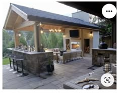 an outdoor kitchen and living room are featured in this video