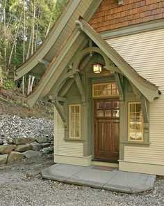 a small house with a wooden door and windows