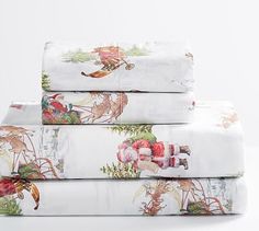 three sheets are stacked on top of each other in front of a white background with flowers and birds