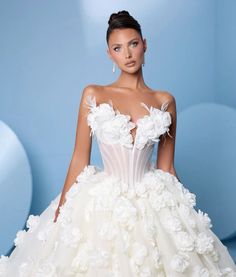 a woman in a wedding dress with flowers on it