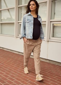 The ‘it girl’ pants of your pregnancy. Woven together in a lightweight fabric, these drapey ankle pants feature a tapered silhouette, oversized pockets, and an adjustable stretchy waistband to grow with you, trimester to trimester. Size down for a less slouchy look! 92% rayon / 8% polyester Machine wash cold with like colors. Do not bleach. Tumble dry low. Iron low heat. Ideal for second and third trimester Inseam: 27” Bianca is 5’9”, 33 weeks pregnant, and wearing size S To wear with anything y Casual Maternity Bottoms For Summer, Casual Summer Maternity Bottoms, Maternity Pants With Elastic Waistband, Casual Straight Leg Maternity Bottoms, Spring Maternity Bottoms Nursing Friendly, Bump Friendly Maternity Bottoms For Summer, Casual Maternity Pants With Relaxed Fit, Casual Maternity Bottoms For Spring, Casual Relaxed Fit Maternity Pants