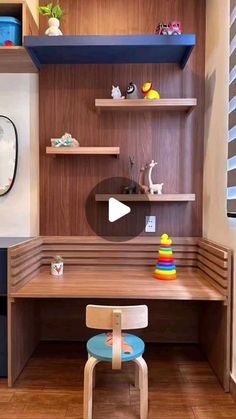 a child's desk and chair in a small room with shelves on the wall