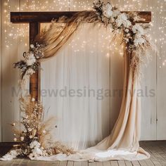 a wedding arch decorated with flowers and greenery