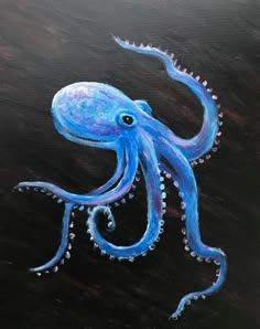 an octopus painted on a black board with blue and white dots in it's tentacles