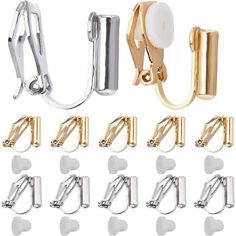 several different types of metal clips and hooks