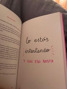 an open book with spanish writing on it