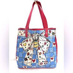 Cats And Dogs And Bows, Oh My! This Brighton Tom Clancy Blue And Red Large Canvas Tote Bag Has Lots Of Fun Designs On It. There's A Cat, Dog, A Big Bow And Hearts. It Wants To Give You Love And Sparkle. Inside Is A Zipped Pocket. Very Good Condition. Minimal Visible Wear. Never Carried But A Few Smudges From Storage. This Is A Pre-Owned Item And May Have Fading Or Discoloration, Marks Or Stains, Scratches, Wrinkling, Wear On Straps, Corners, Trim And Texture. If This Is An Issue, Buyers Should P Cute Red Bags For Valentine's Day, Playful Red Shoulder Bag For Daily Use, Cute Red Bag With Removable Pouch, Cute Red Bags With Removable Pouch, Playful Blue Bag With Adjustable Strap, Playful Red Everyday Bag, Playful Red Bag For Gift, Fun Blue Everyday Bags, Cute Bags For Everyday Use And Valentine's Day