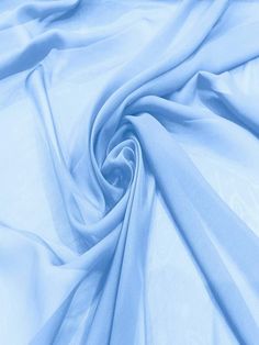 Elevate your sewing projects with this luxurious 60" wide silky chiffon fabric. Made from 100% polyester, this imitation silk chiffon boasts a super soft and flowy texture that drapes beautifully. Perfect for apparel, costumes, or decorations, this versatile fabric offers a lightweight and airy feel. With its generous width, you can create stunning garments or decorative accents with minimal seams. Embrace the elegance of this silky chiffon and let your creativity flow. Wide Width: This chiffon fabric measures 58 inches wide, providing ample material for apparel, costumes, or decorations. Silky Texture: Enjoy the luxurious feel of imitation silk chiffon fabric with its soft and flowy texture. Lightweight Material: Made from 100% polyester, this chiffon fabric is lightweight and airy. Versa Silk Chiffon Fabric, Recycled Fashion, Decorative Accents, Colour Schemes, Silk Chiffon, Steel Blue, Chiffon Fabric, Blue Fabric, Fabric By The Yard