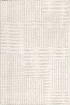 a white rug with squares and lines on it