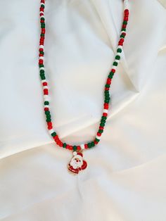 🎄 Embrace the holiday spirit with our Christmas Color Beaded Necklace featuring a charming metal Santa pendant! 🎅Handcrafted with love, this festive accessory blends the classic colors of Christmas - vibrant reds and lush greens - into a harmonious symphony of holiday cheer. 🌟 The star of the show is our small, adorable Santa pendant, adding a touch of whimsy and merriment to your ensemble. Crafted with attention to detail, this jolly Santa brings a sprinkle of magic to your festive look. ✨ Versatile and lightweight, this necklace is perfect for holiday parties, family gatherings, or simply adding a touch of Christmas joy to your everyday wear. It also makes a delightful gift for loved ones, spreading warmth and good cheer. 🎁 Packaged with care, our Christmas Color Beaded Necklace with Color Beaded Necklace, Holiday Bracelets, Green Beaded Necklace, Christmas Color, Snowflake Earrings, Jolly Santa, Christmas Bracelet, Necklace Red, Jewelry Christmas